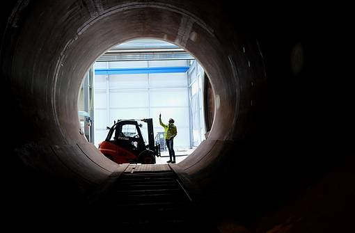 View through the large Steuler autoclave at a fitter with a forklift