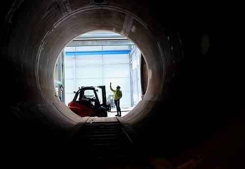 View through the large Steuler autoclave at a fitter with a forklift